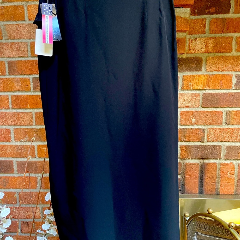 Black skirt with side ruffle in excellent condition.